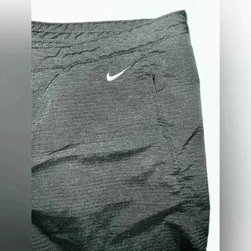 Nike pants, button,zip, ankle slit, mesh back knee
